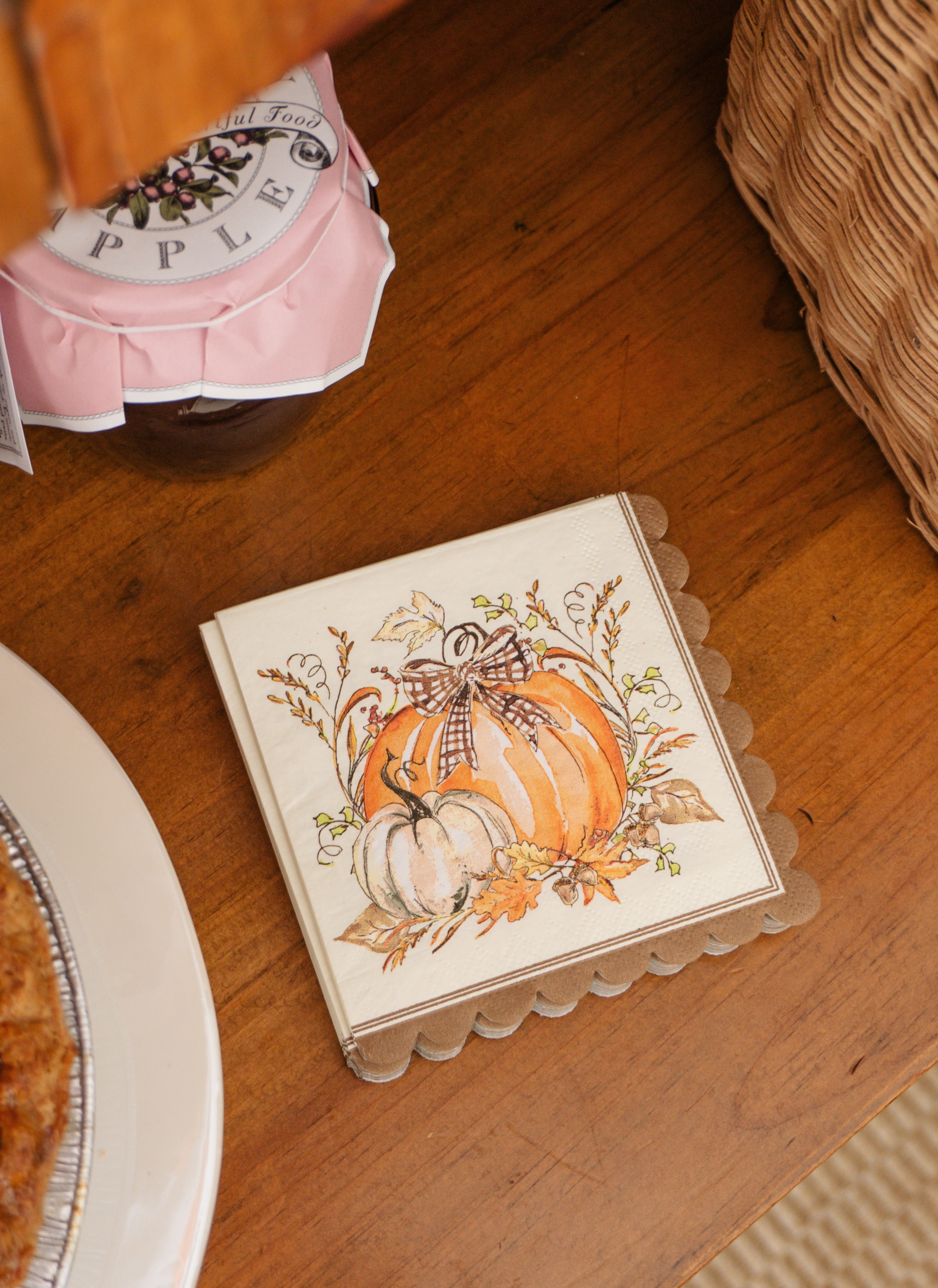 Turkey & Gourds Cocktail Napkins/26pk, featuring scalloped edges and an illustration of gourds with a plaid bow.