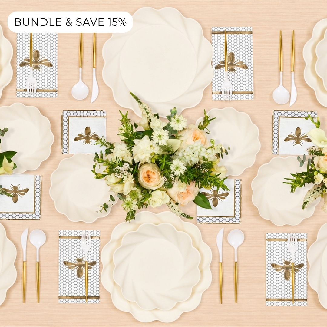 Create a refined tablescape for 16 with the Sophistiplate LLC Rosh Tablescape for 16 Guests: Eco Cream Honeybee set, featuring cream-colored scalloped compostable plates, bee-themed napkins, gold and white cutlery, and floral centerpieces on a light wood surface. Enjoy BUNDLE & SAVE 15% in the top left corner.