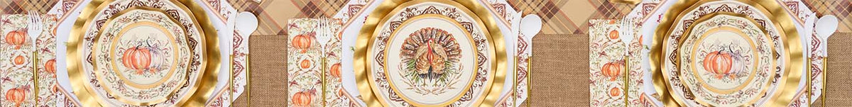 A fall-themed table setting with woven placemats, plates featuring autumn leaves, green napkins with utensils, and a floral centerpiece with roses and greenery.