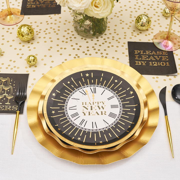 Midnight Sparkle Salad Plates/8pk featuring a black and gold salad plate with a clock face design that reads Happy New Year.