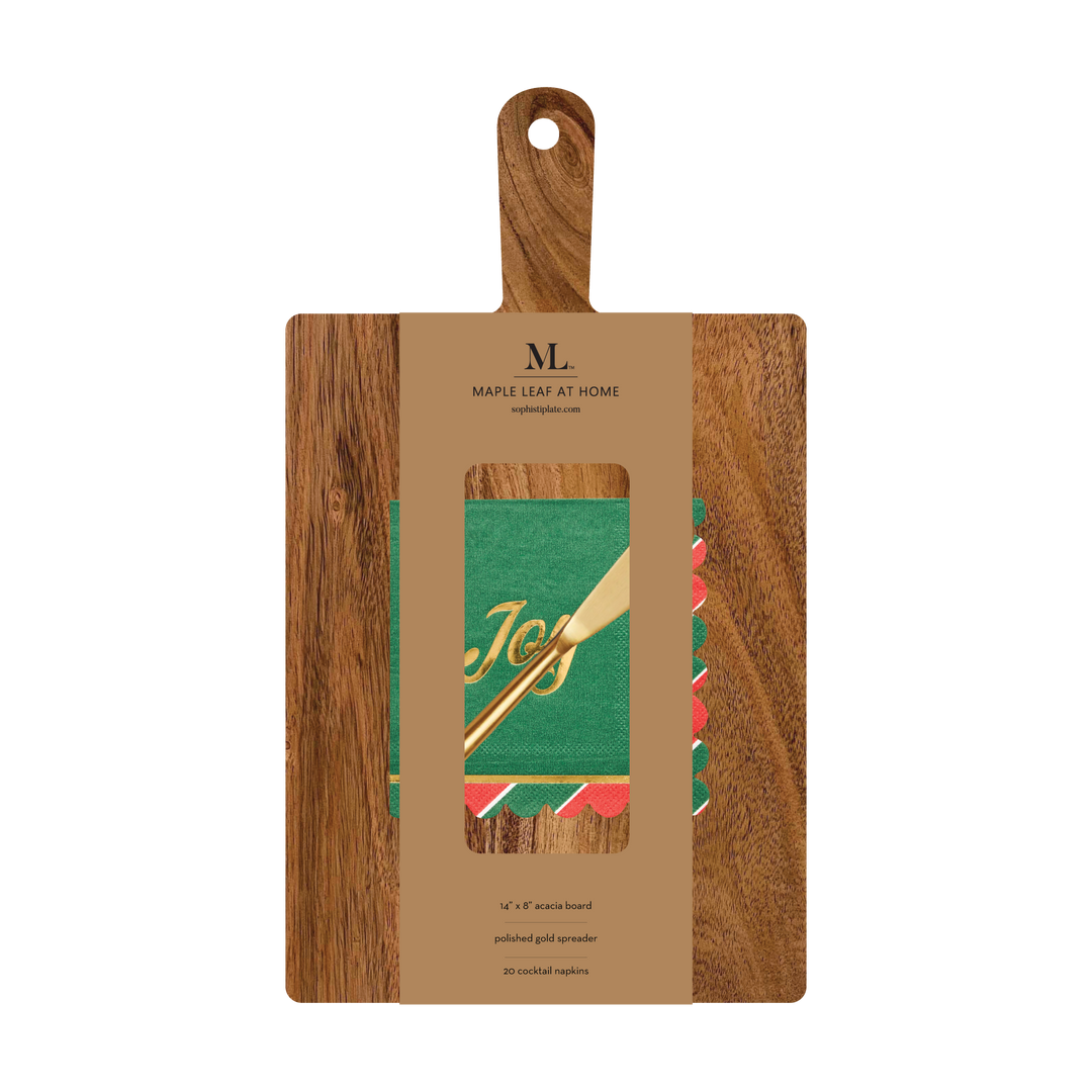 A 14″ x 8″ Board Gift Kit w/ Gold Spreader: Joyful Christmas, featuring an acacia wood charcuterie board, a gold spreader, and a stack of green cocktail napkins with a gold Joy print.