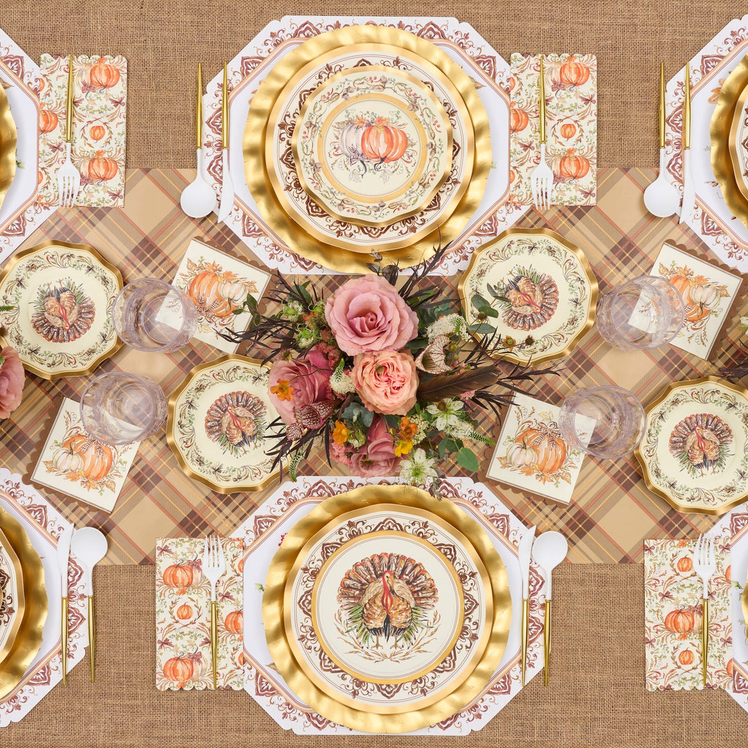Sure! Here’s the revised sentence using your provided product data: Celebrate Thanksgiving in style with the Turkey & Gourds Table Setting by Sophistiplate, a fall-themed party-in-a-box that includes designer disposable plates adorned with turkeys and pumpkins, gold chargers, a floral centerpiece featuring pink roses, a plaid tablecloth, and matching napkins—all beautifully coordinated to create stunning Thanksgiving table decor when viewed from above.