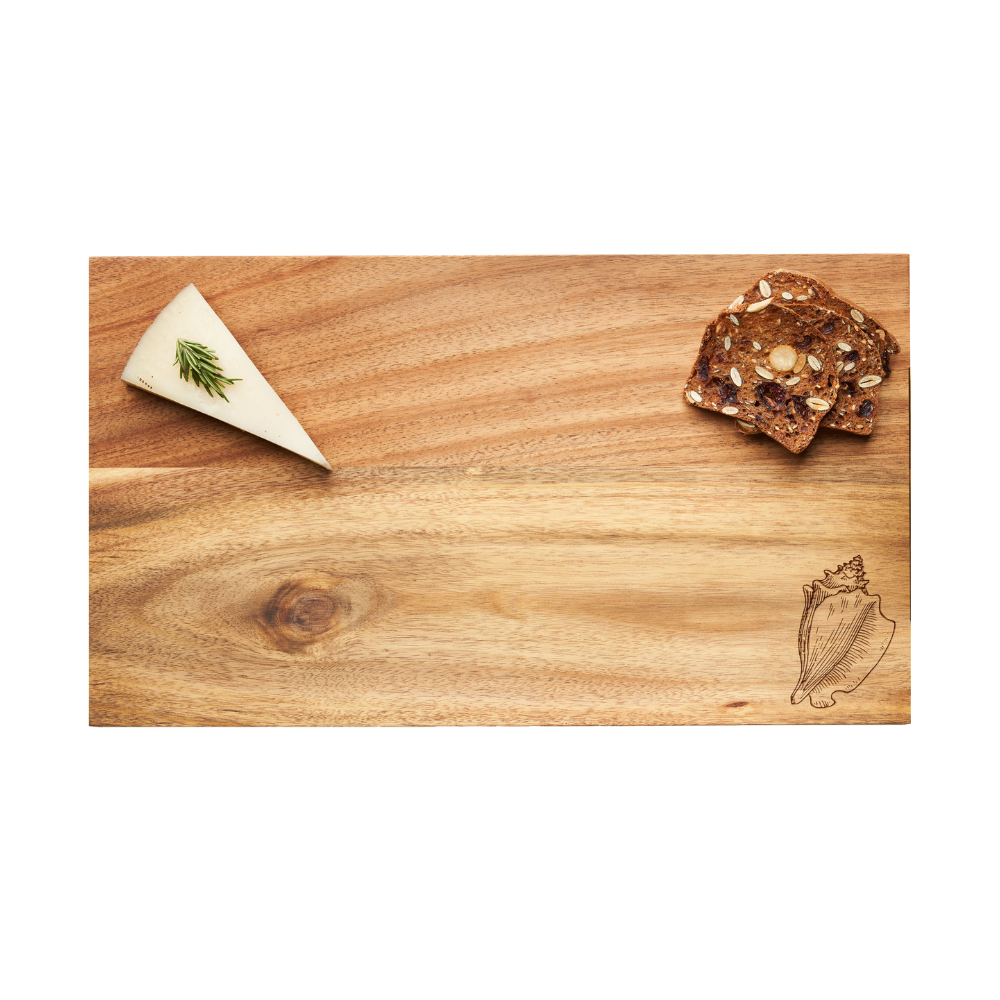 A wedge of cheese topped with herbs rests on the left side of the Maple Acacia Modern Rectangle Board in Conch Shell (14 x 8″), while a small stack of seeded crackers sits at the top right.