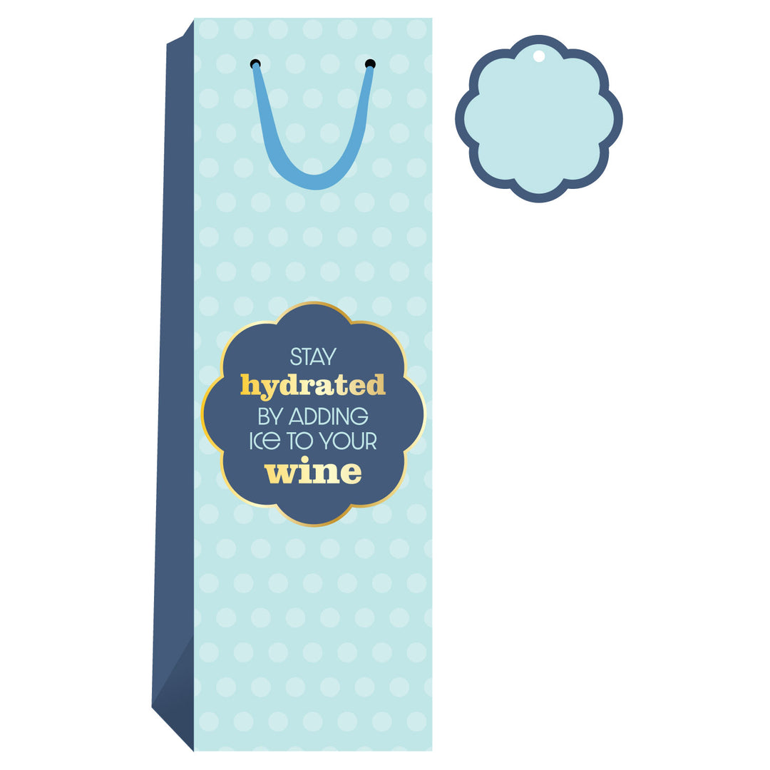The Drinks On Me Stay Hydrated Wine Bag features light blue with white polka dots, blue panels and handle, a fun "Stay hydrated by adding ice to your wine" label, plus a matching gift tag—perfect for hostess gifting.