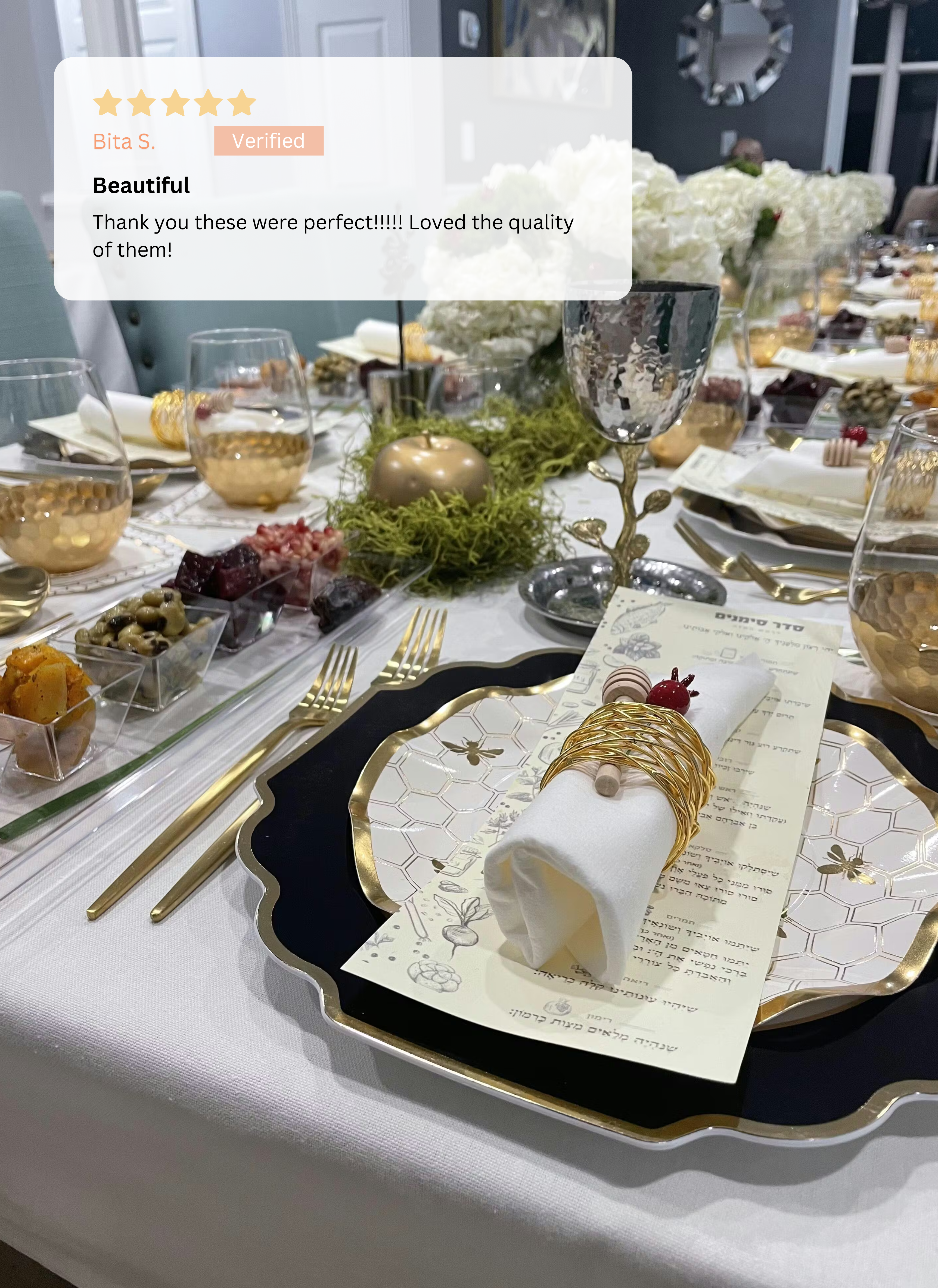 The Honeybee Table Setting by Sophistiplate LLC features gold-rimmed heavy duty plates, wine glasses, napkins with gold rings, a menu, appetizers, and floral centerpieces. A five-star review praising its beauty and quality overlays the image.