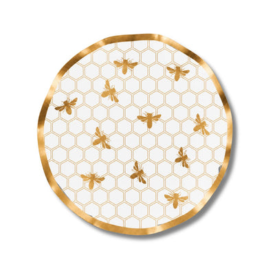 The Sophistiplate Honeybee Wavy Paper Salad Plate (8pk) features a charming honeycomb pattern with gold bees on a crisp white background, elegantly bordered by a gold rim and finished with a delicate ruffled edge, making it the perfect choice to showcase an enchanting honeybee design at your next gathering.