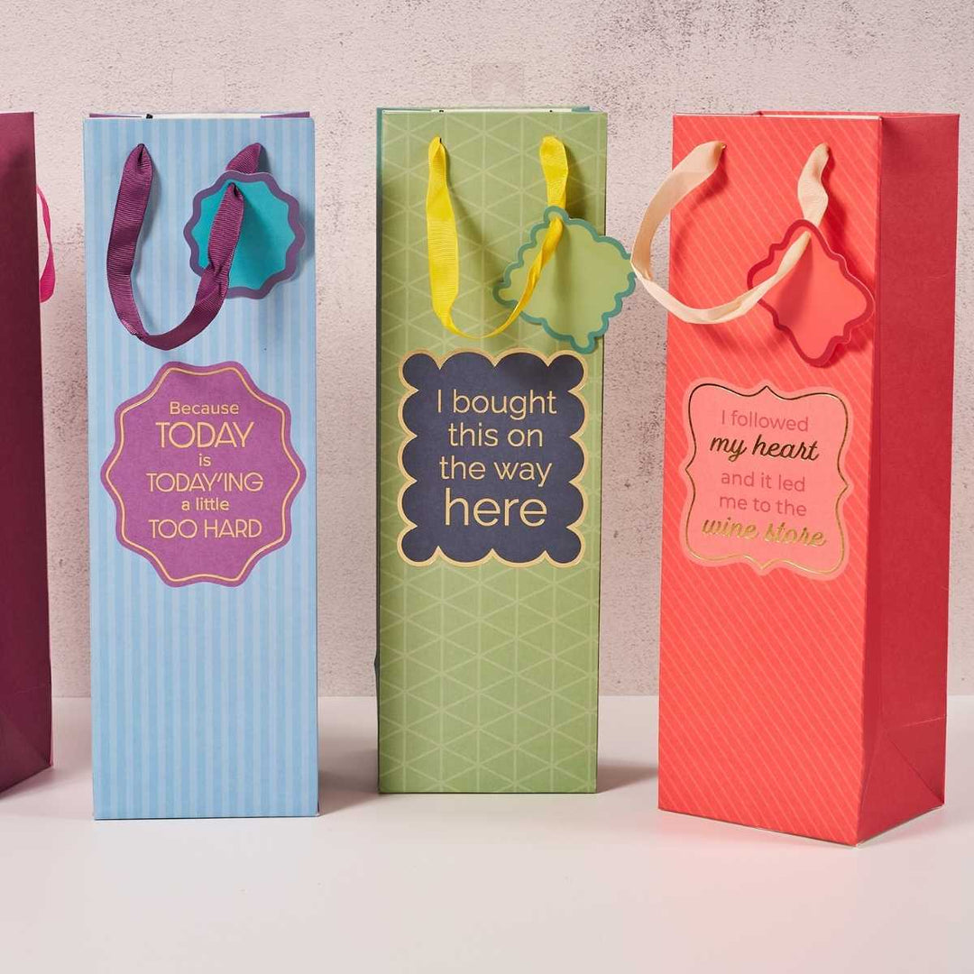 Drinks On Me Wine Store-Wine Bags: Set of 3 colorful, reusable gift bags with witty labels—“Because today is today-ing too hard,” “I bought this on the way here,” and “I followed my heart to the wine store.”.