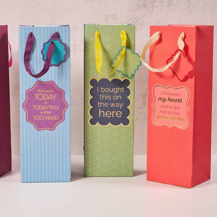 Drinks On Me Wine Store-Wine Bags: Set of 3 colorful, reusable gift bags with witty labels—“Because today is today-ing too hard,” “I bought this on the way here,” and “I followed my heart to the wine store.”.