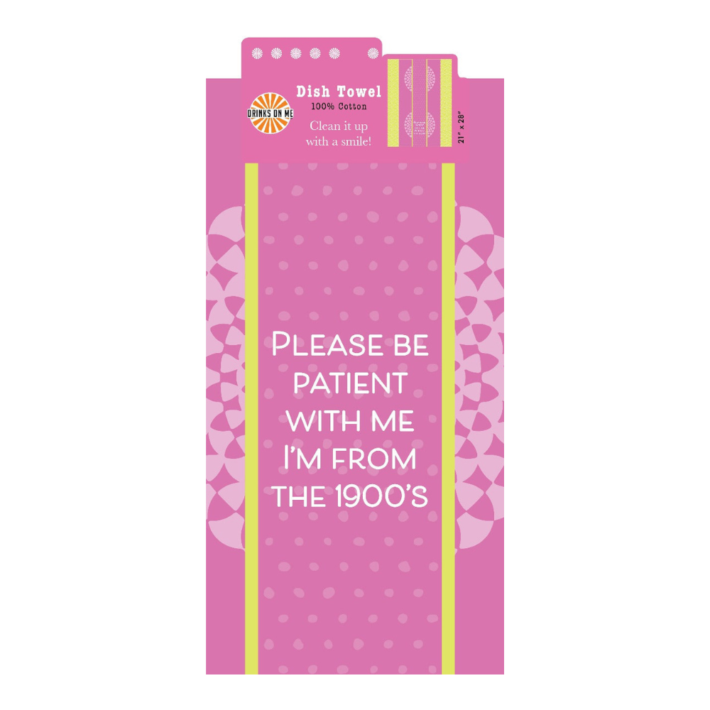 The Drinks On Me 1900's Towel is a pink cotton dish towel with playful patterns and the text: "Please be patient with me, I'm from the 1900s." A funny and charming housewarming gift for any kitchen.