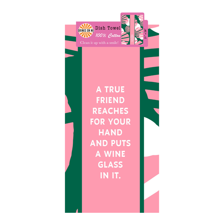 The True Friend Dish Towel by Drinks On Me features pink and green colors with the text: "A true friend reaches for your hand and puts a wine glass in it." A fun, 100% cotton housewarming gift.