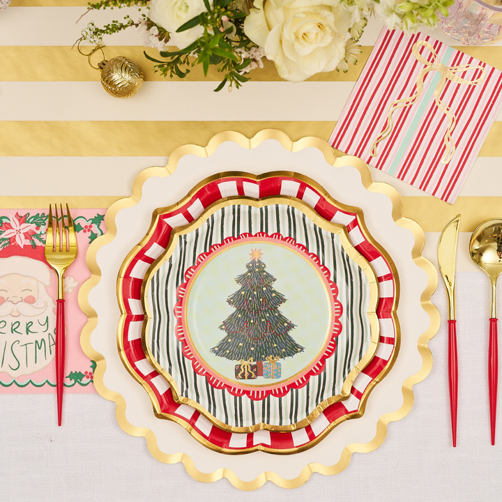 Create a festive table setting with Sophistiplate’s Tis the Season Salad Plates (pack of 8), each layered to showcase their charming Christmas tree design. Pair them with gold-striped placemats, gold utensils, and holiday-themed napkins for a joyful holiday look. Complete the scene with white flowers and sparkling gold ornaments as elegant accents.