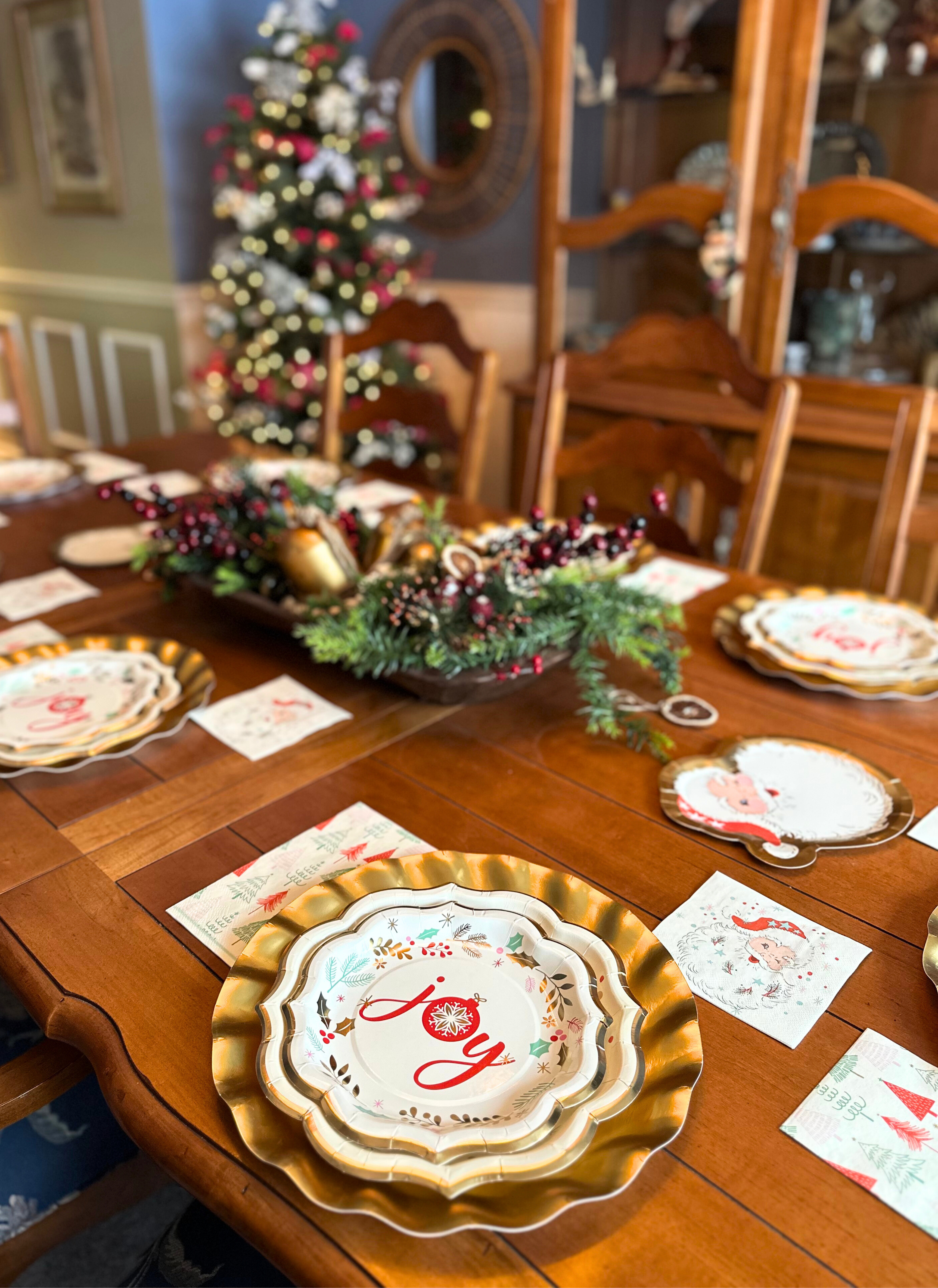 Set a festive scene with Vintage Santa: Christmas Table for 16 by Sophistiplate LLC, featuring designer paper plates and napkins for 16 and a holiday backdrop for a warm Christmas tablescape.