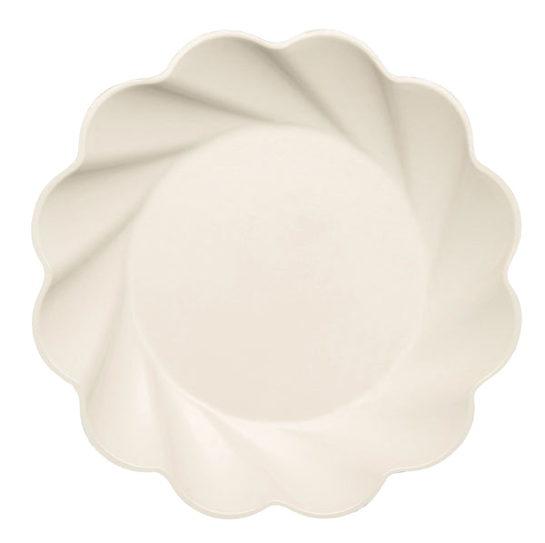 The Eco Cream & Sage Table Setting by Sophistiplate LLC features a round, cream-colored plate with scalloped edges and a subtle swirling pattern, set against a white background. Eco-friendly design combines elegance with sustainability.