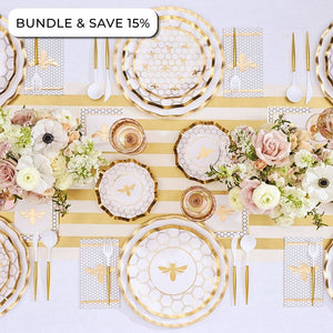 Create an elegant table setting with the Sophistiplate LLC Rosh Tablescape for 16 Guests: White Honeybee, featuring gold bee-themed Rosh Hashanah tableware, a striped table runner, floral arrangements, designer paper plates, coordinating paper napkins, and plastic cutlery. Text in the corner reads BUNDLE & SAVE 15%.