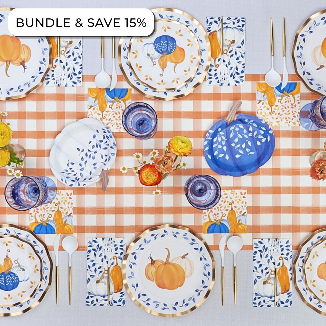 Sophistiplate’s Harvest Blues: Thanksgiving Table for 16 featuring heavy duty paper plates, napkins, and cups decorated with orange and blue pumpkin patterns on a plaid tablecloth, with a Bundle & Save 15% label in the corner.