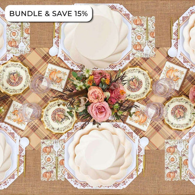 Overhead view of an Ivory Harvest: Thanksgiving Table for 16 set with floral-patterned compostable plates, pumpkin-illustrated napkins, a floral centerpiece, and cutlery, with a tag reading BUNDLE & SAVE 15%.