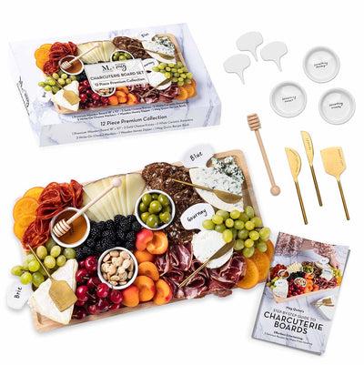 The Maple Meg Quinn Charcuterie Board & Accessories Kit features a 12-piece set with a wooden board, assorted meats, cheeses, fruits, crackers, cheese knives, labeled markers, ceramic ramekins, a honey dipper, and a charcuterie guidebook.