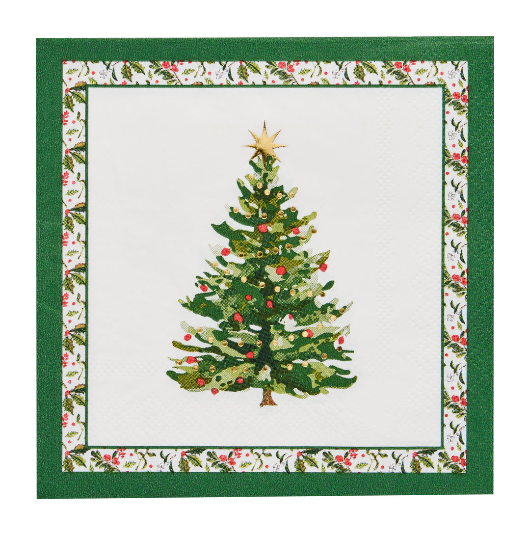 The Sophistiplate Home for the Holidays Cocktail Napkins (26pk) feature a decorated Christmas tree with a gold star on top, centered on a white background. With a border of holly and red berries and a green outer edge, these festive napkins are the perfect addition to your Christmas party supplies.