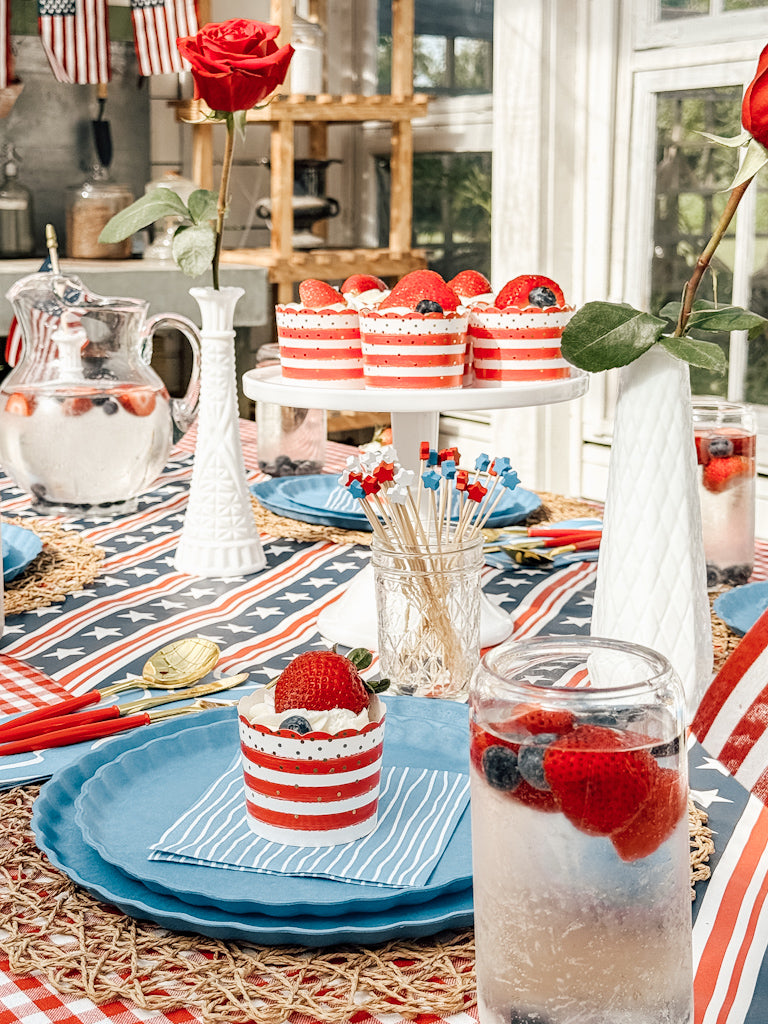 Celebrate in style with Sophistiplate LLC’s Patriotic French Blue plates—eco-friendly, festively designed with red, white, and blue accents—perfect for striped cupcakes, berry-topped drinks, roses, and American flag decor.