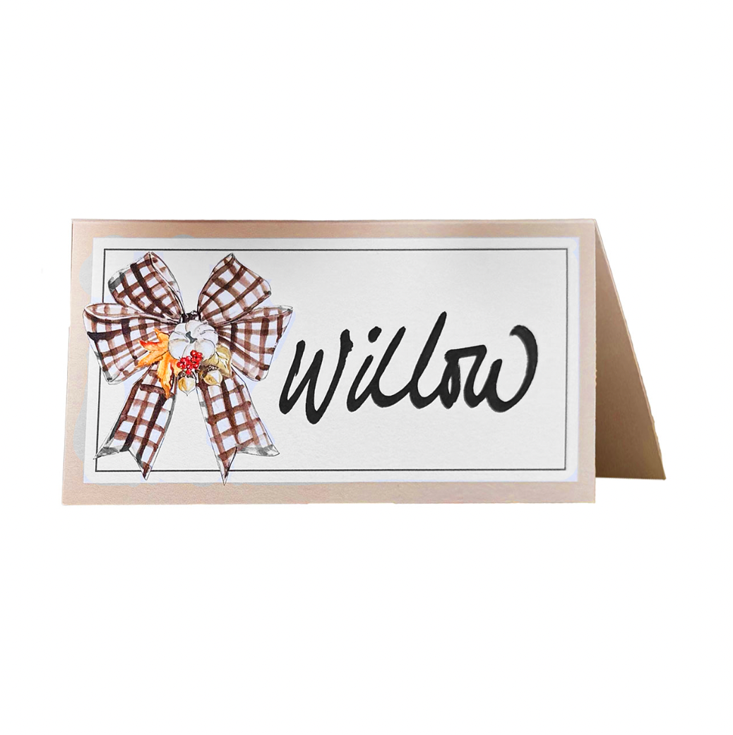 A folded Rosanne Beck Turkey & Gourds Bow Place Card with 