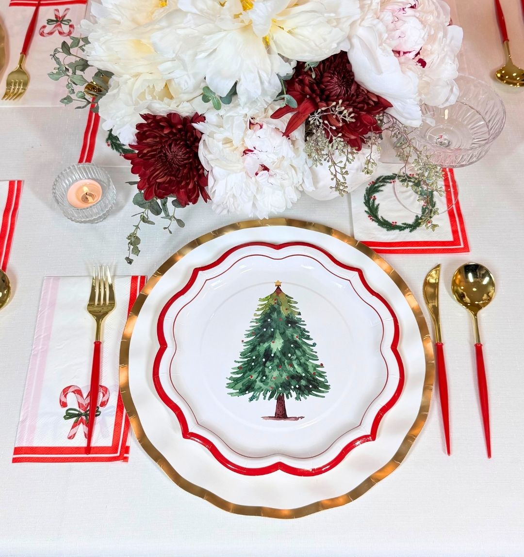 Create a festive holiday table with the Merry & Bright: Christmas Table for 16—includes tree-adorned plates, gold-rimmed chargers, red and gold cutlery, holiday napkins, and more. Heavy duty paper plates ensure easy cleanup after your celebration.