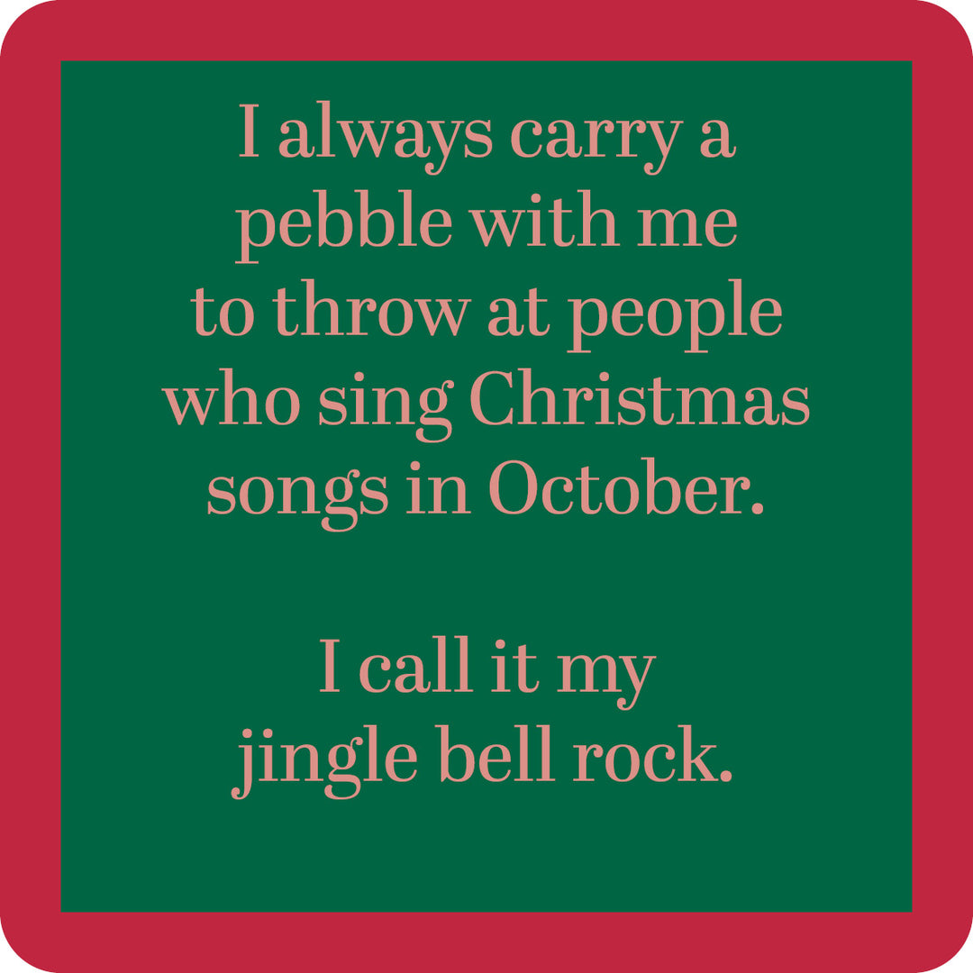 The Jingle Bell Rock Coaster by Drinks On Me features a green sign with a red border that reads: "I always carry a pebble with me to throw at people who sing Christmas songs in October. I call it my jingle bell rock." Perfect funny bar cart accessory or gift.