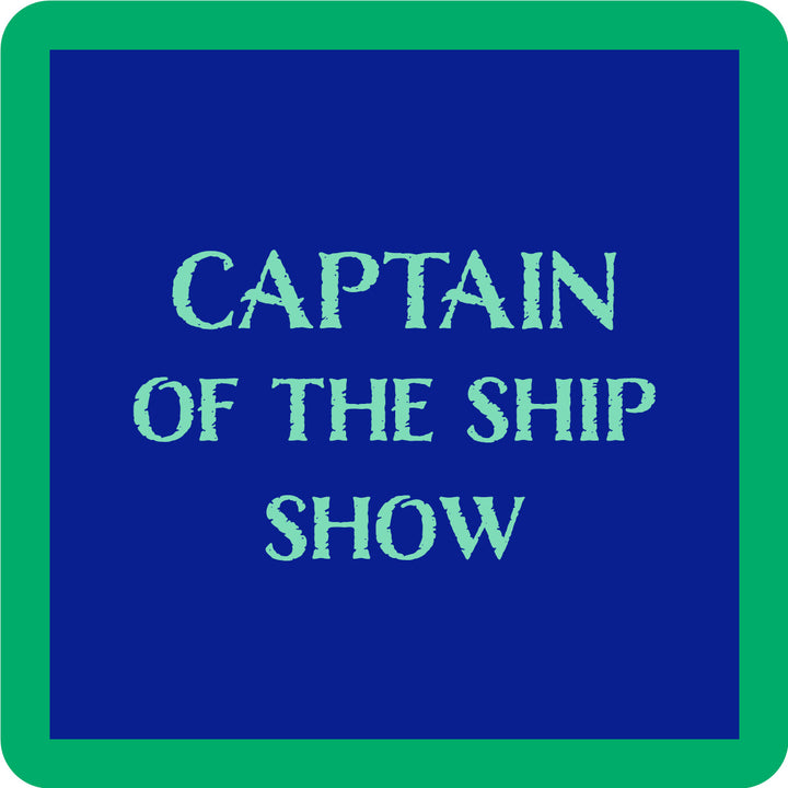 The Captain Coaster by Drinks On Me features a blue square with a green border and bold light blue "CAPTAIN OF THE SHIP SHOW" text—perfect as a funny drink coaster or playful bar cart accessory.