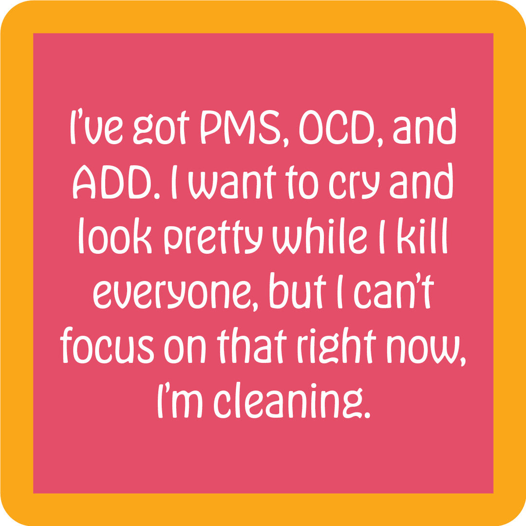 The PMS OCD Coaster by Drinks On Me is a pink square with a bold orange border and witty white text. It’s the perfect funny drink coaster or quirky bar cart accessory—great for unforgettable housewarming gifts!.