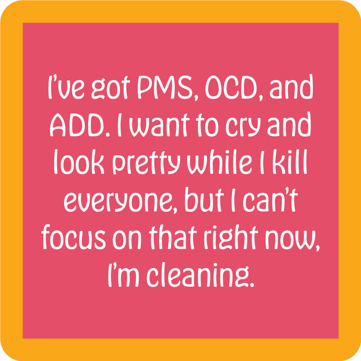The PMS OCD Coaster by Drinks On Me is a pink square with a bold orange border and witty white text. It’s the perfect funny drink coaster or quirky bar cart accessory—great for unforgettable housewarming gifts!.