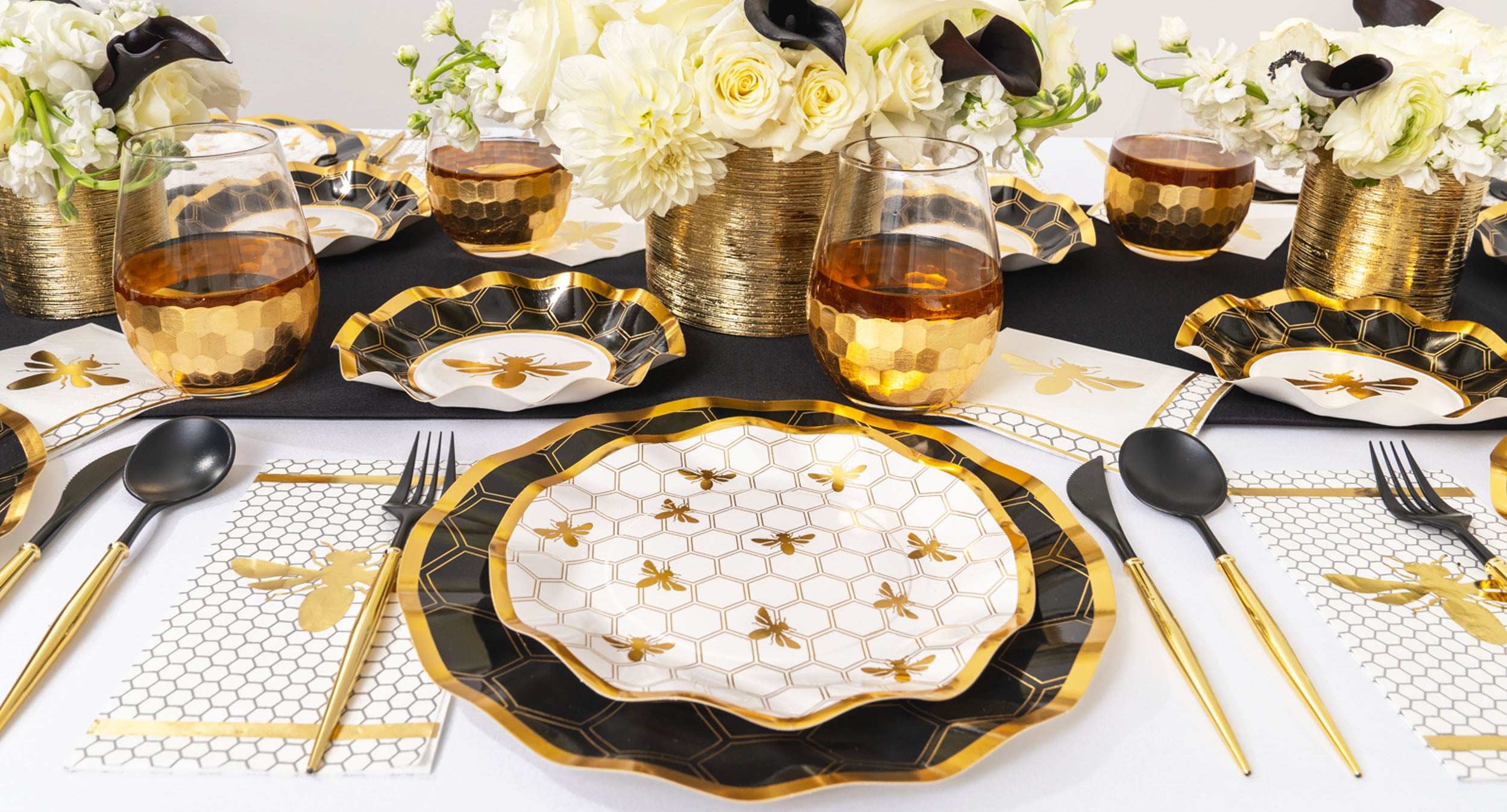 honeybee table setting with black and white florals