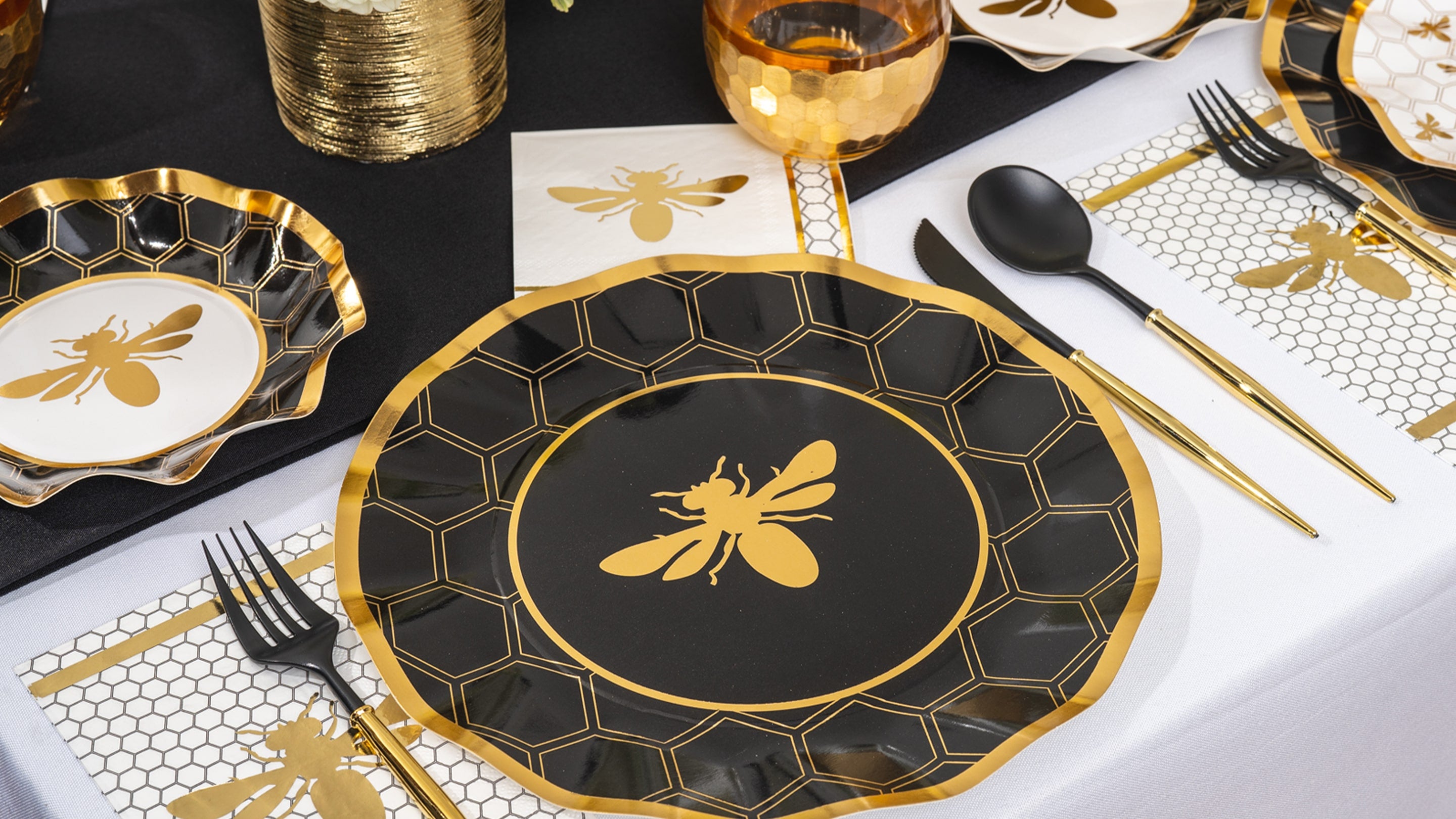 honeybee table setting with black and white florals