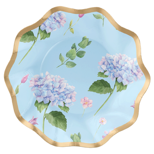 The Sophistiplate Appetizer/Dessert Bowl Hydrangea Foil - 8pk features a gold foil scalloped edge, light blue background, pink and purple hydrangeas, green leaves, and small pink blossoms.